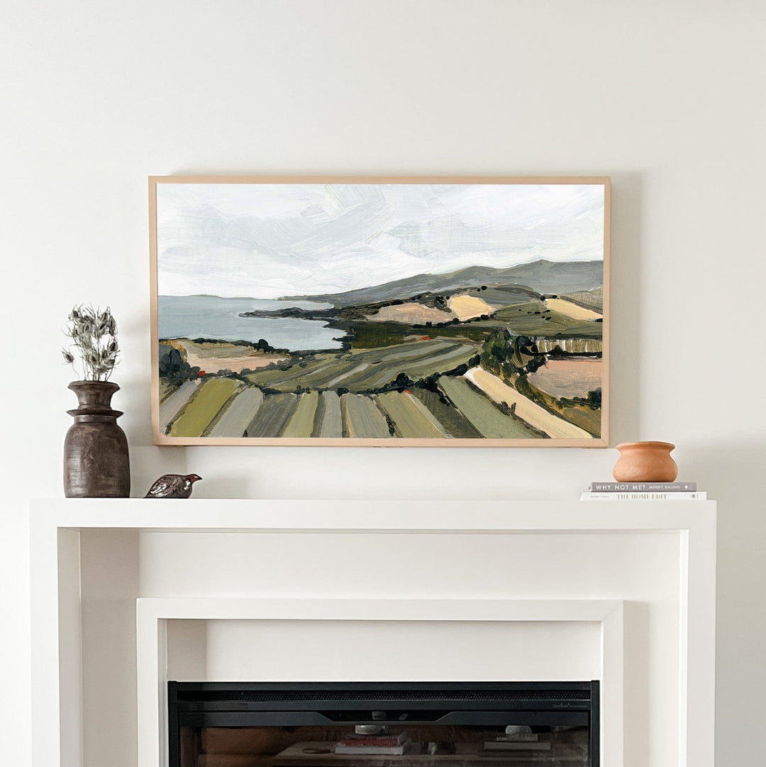 French coast landscape painting above fireplace.