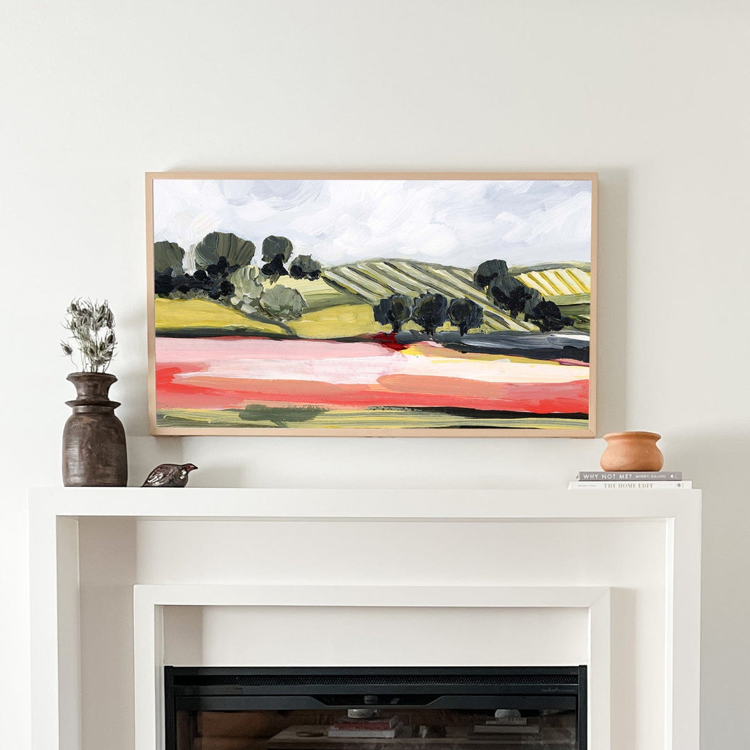 Redfields fireplace setup with landscape art