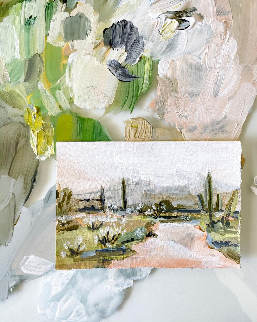 Painting of desert landscape on textured paper.