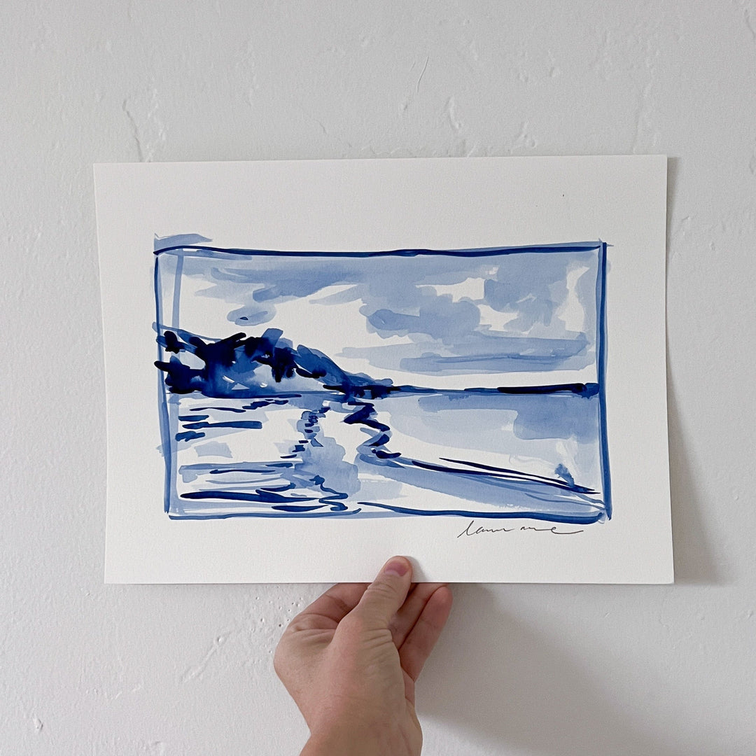 Watercolor painting of a coastal landscape in blue.