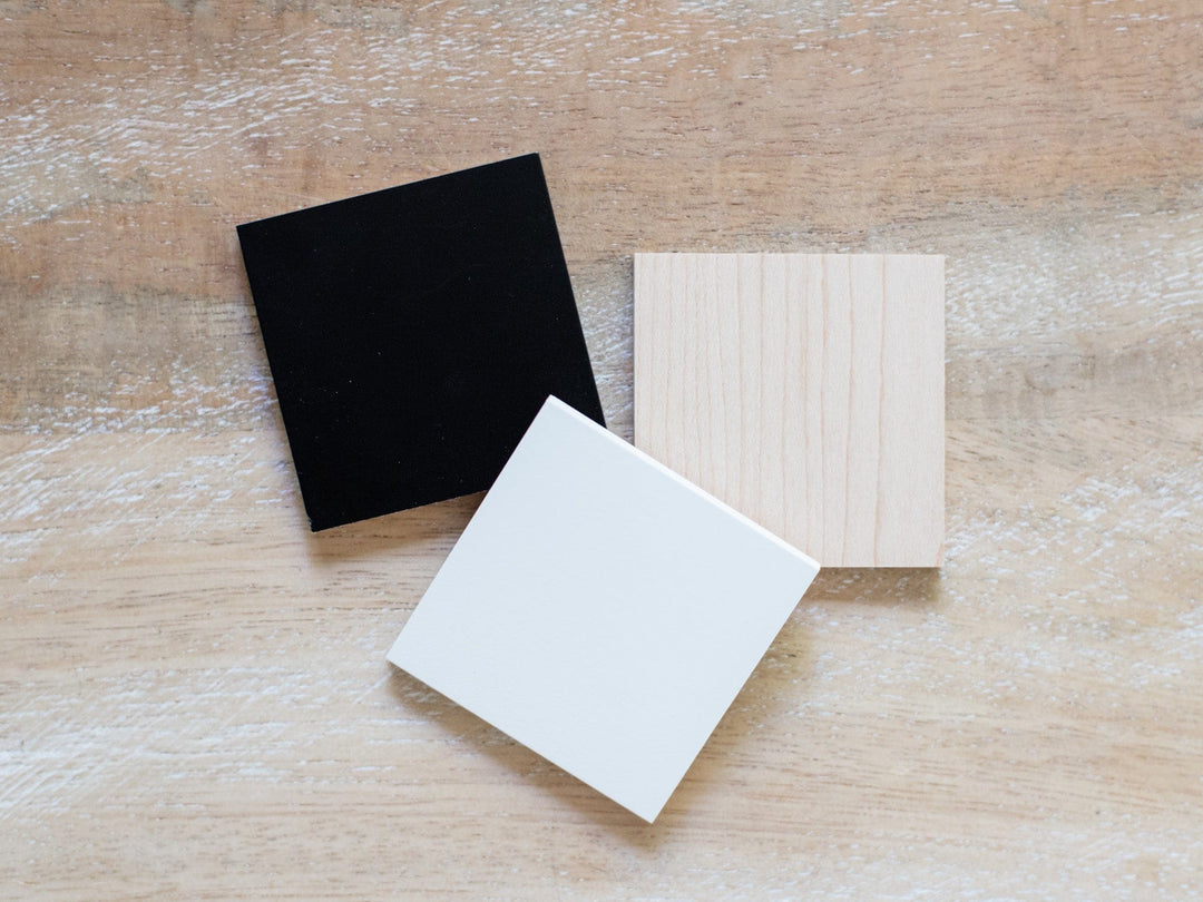 black, white, and wood-grain, on a wood surface.