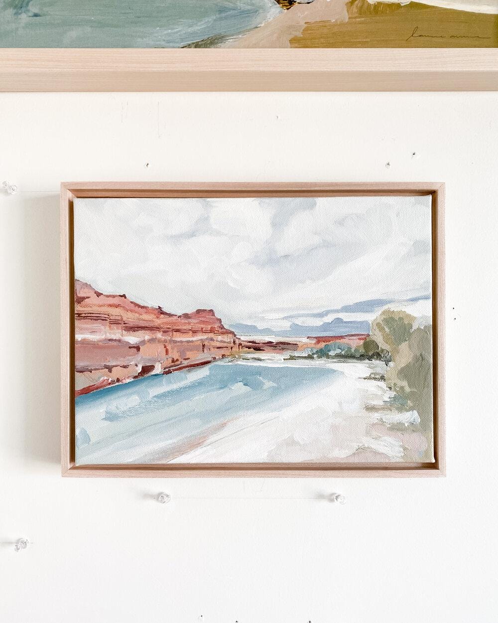 river scene with red rock cliffs.