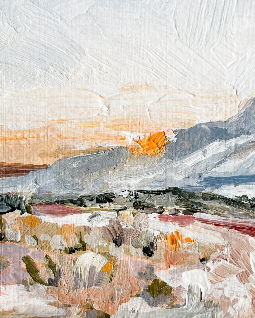 Painting of a landscape with mountains and brushy foreground.