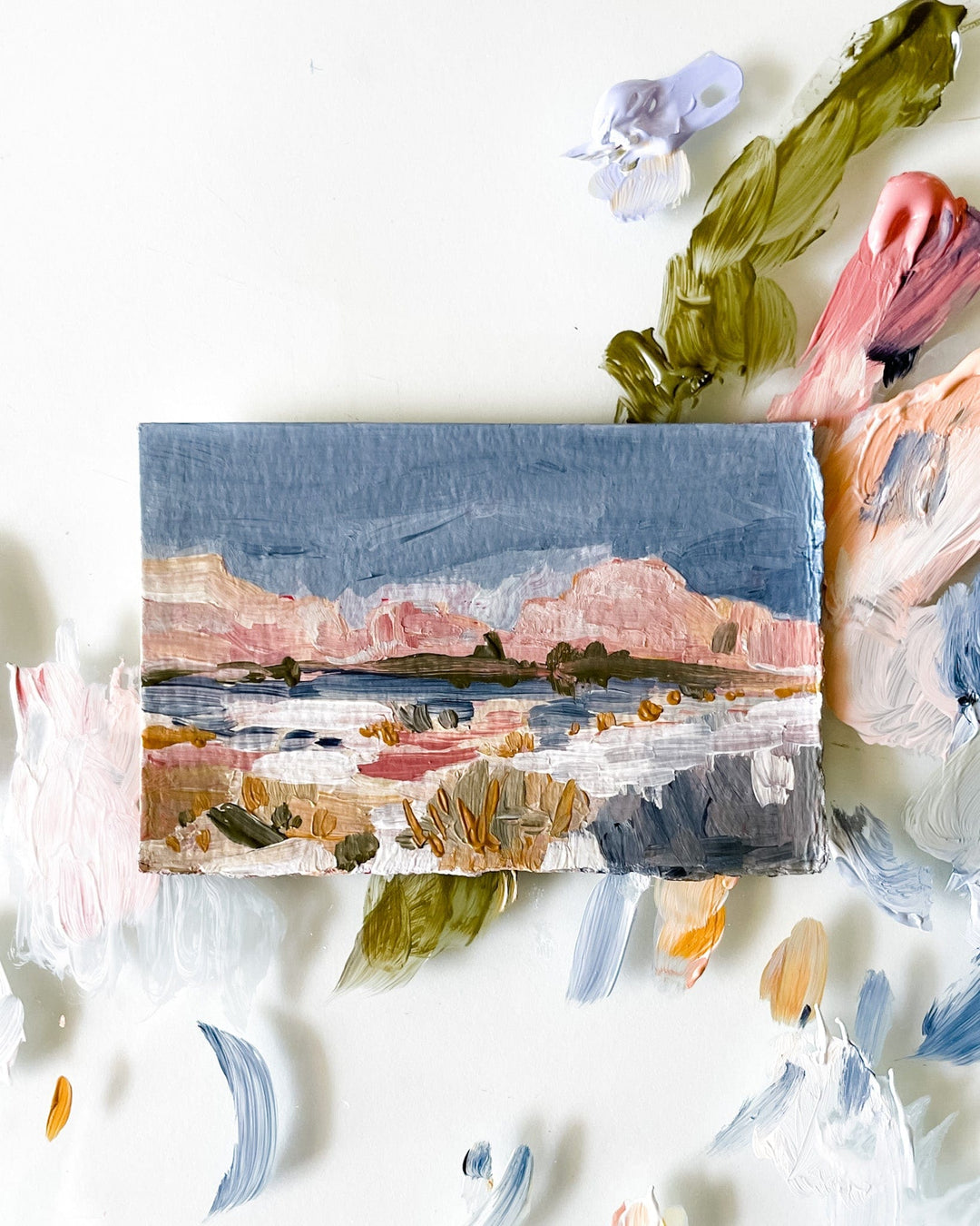Landscape painting with paint splotches.