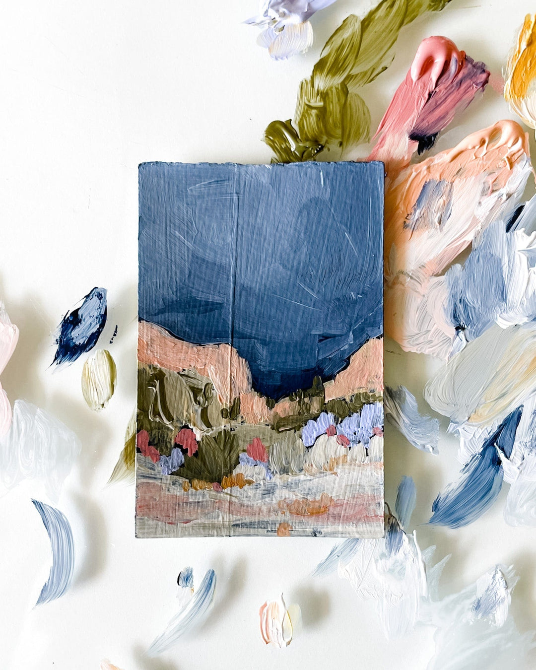 Painting of a landscape with brushstrokes and paint splotches.