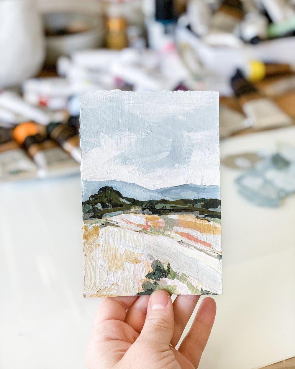 Hand holding landscape painting, IMG_7193