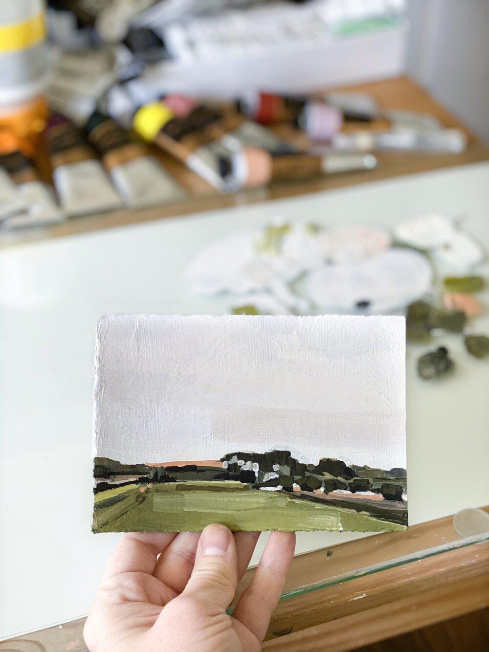 Hand holding landscape painting, IMG_9885