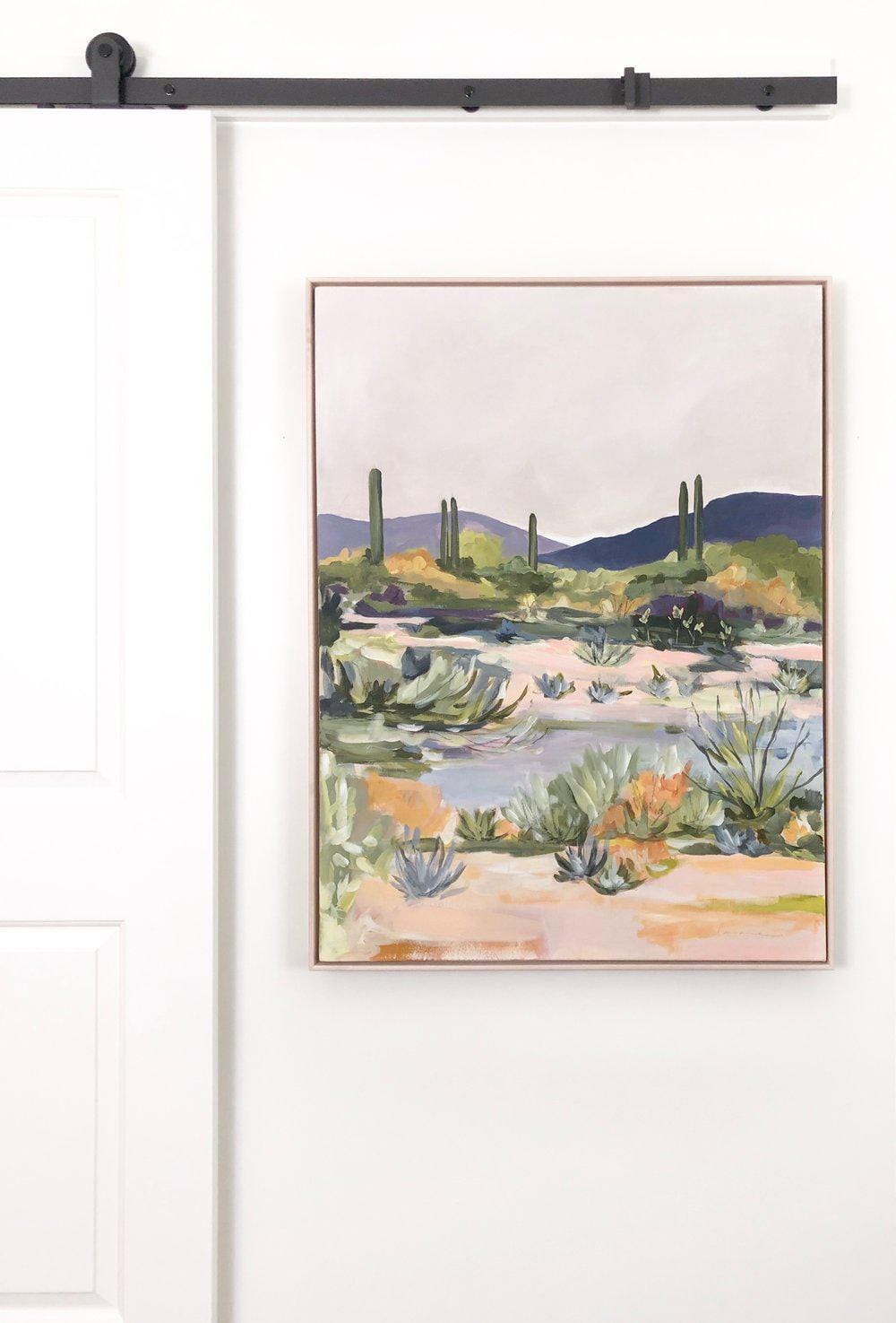 Painting of desert landscape with cacti.