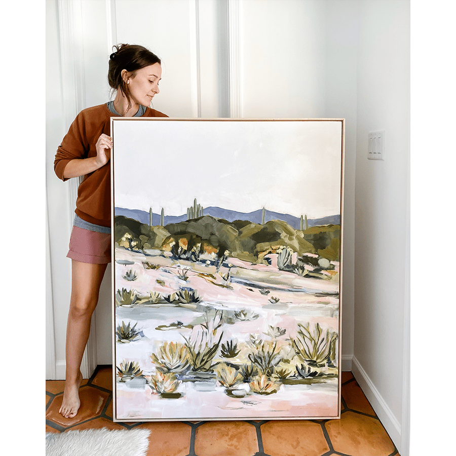 Woman holding Desert Glory painting