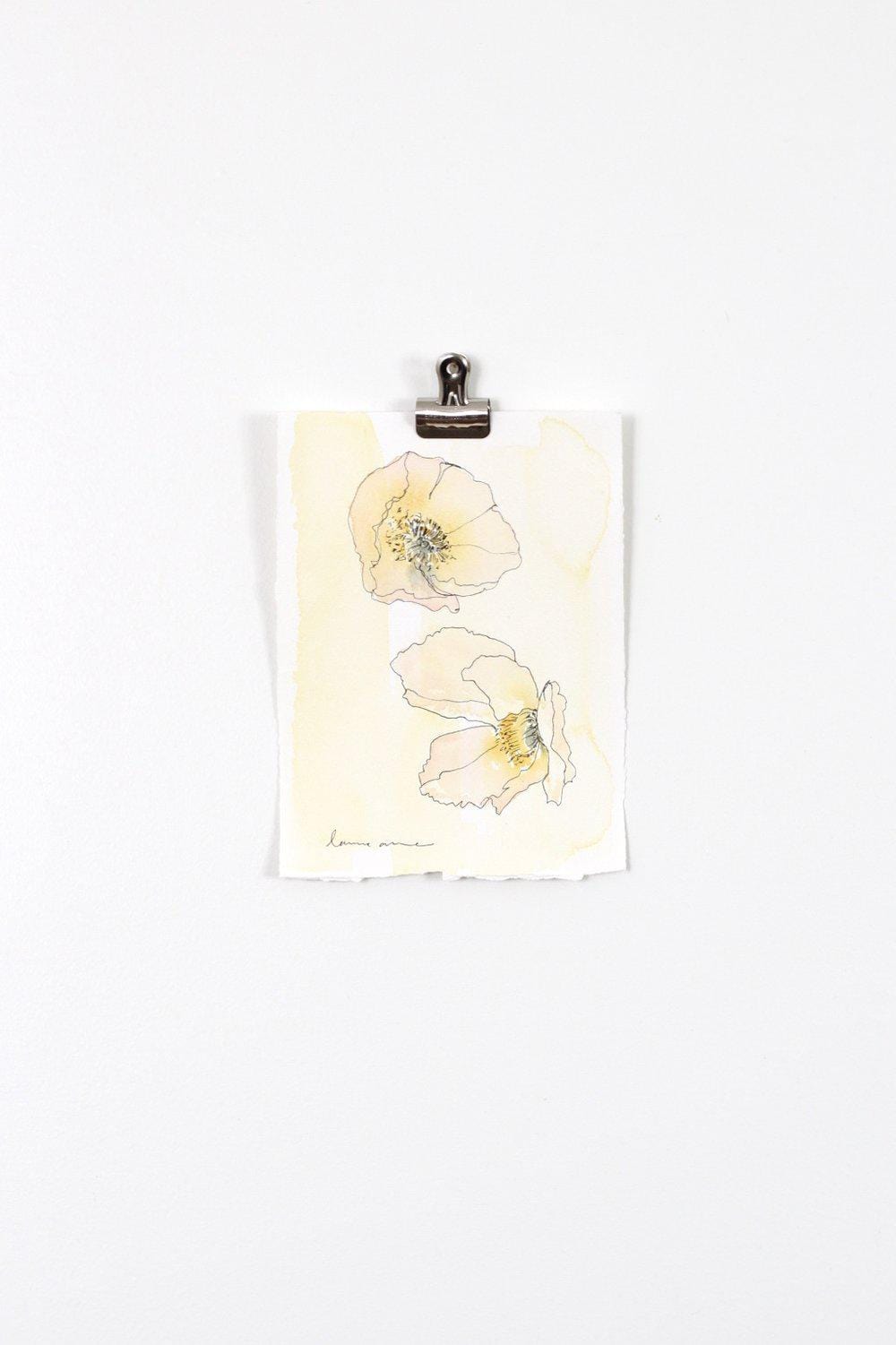 Watercolor painting of two flowers clipped to a white wall.
