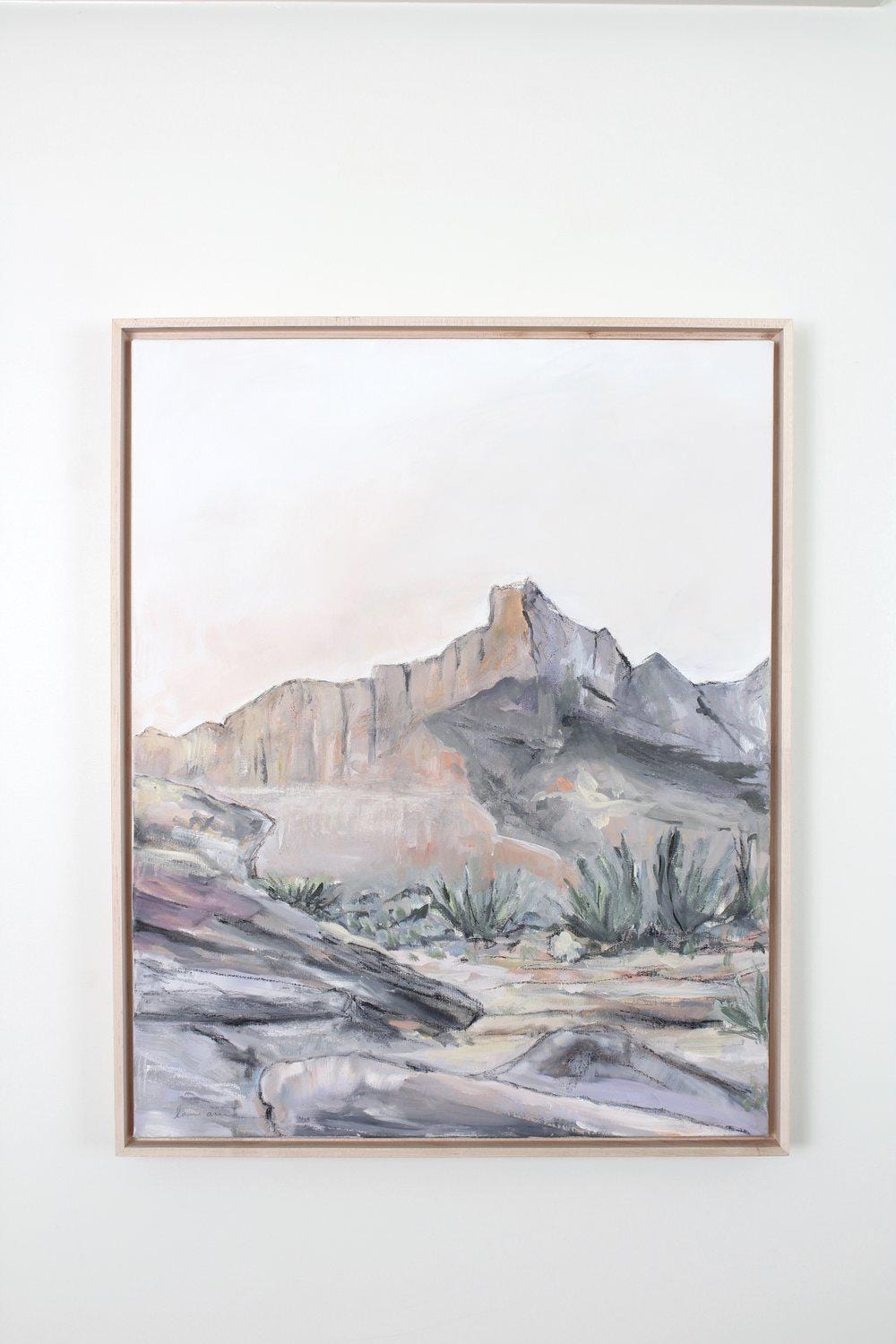 Desert landscape painting in a wooden frame