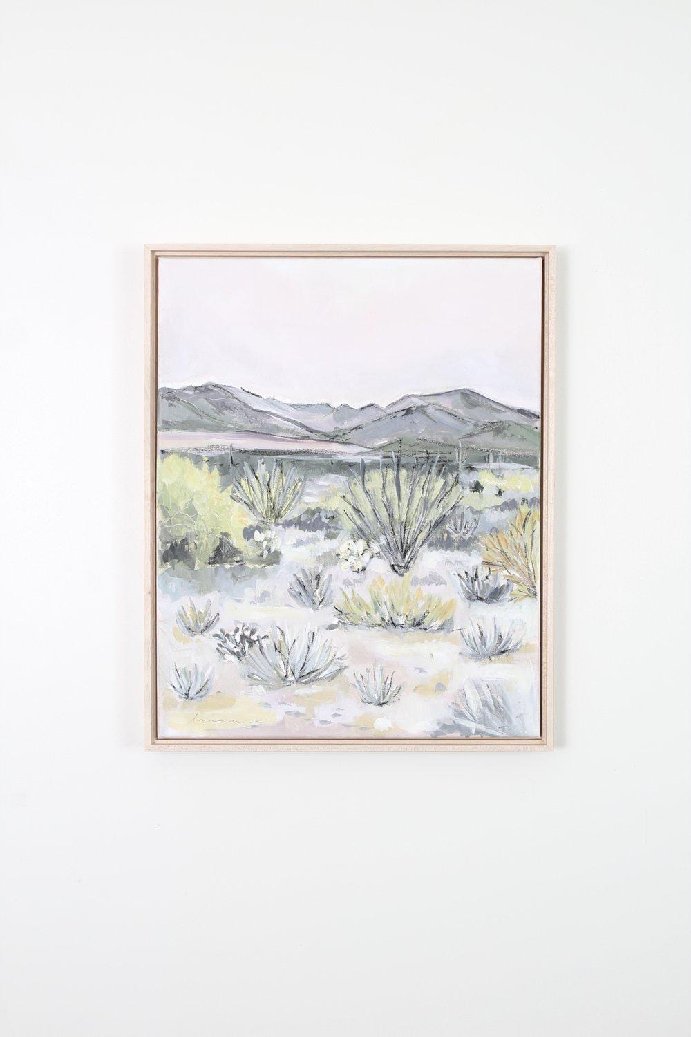 Desert landscape painting in a frame