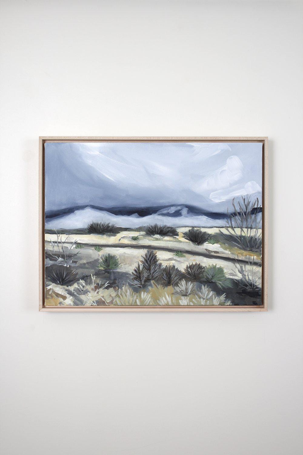 Landscape painting in a wood frame