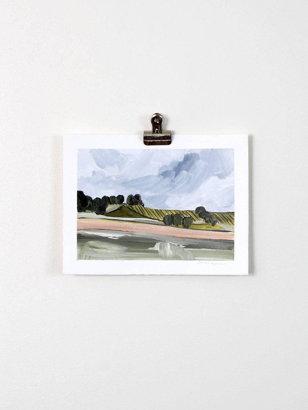 Abstract landscape painting clipped to a wall