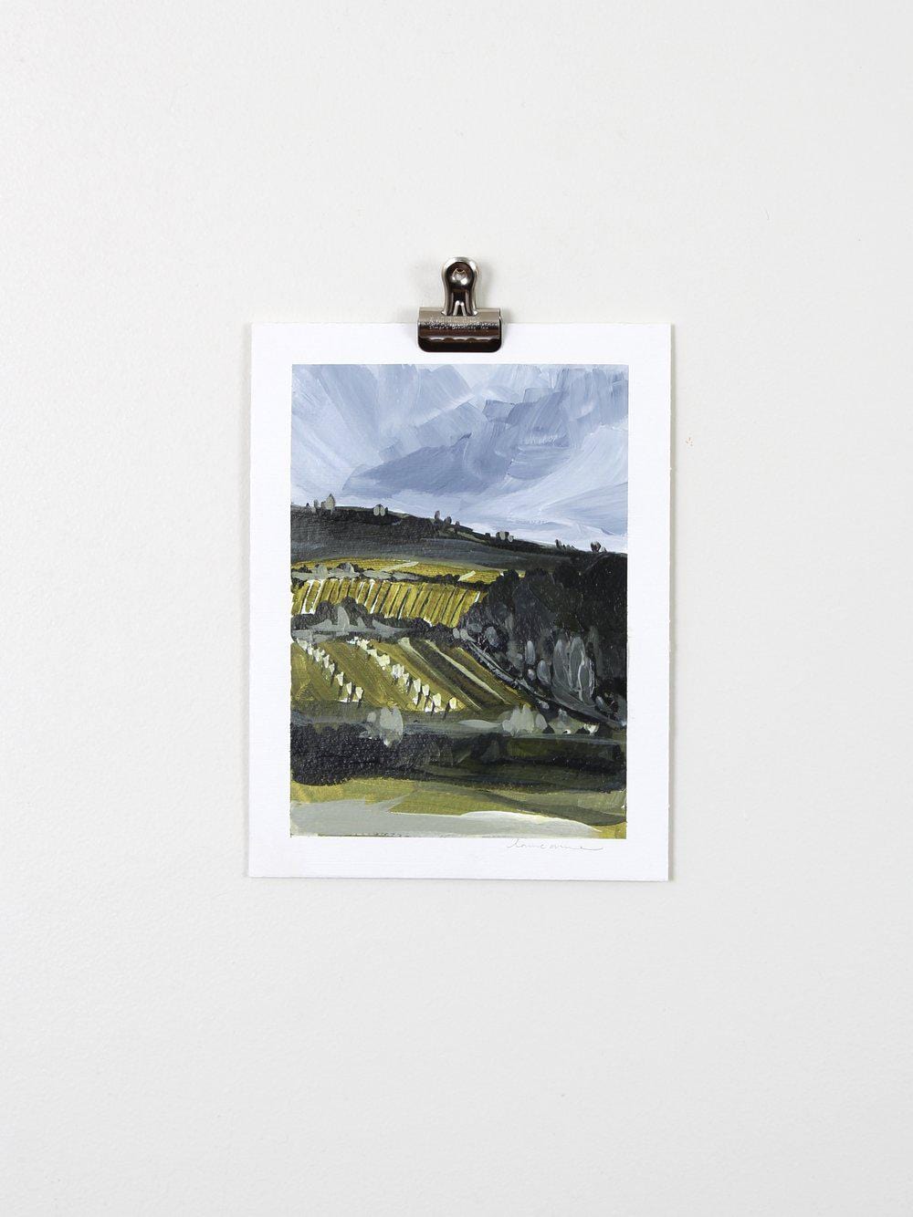Abstract landscape painting on paper, clipped to wall.