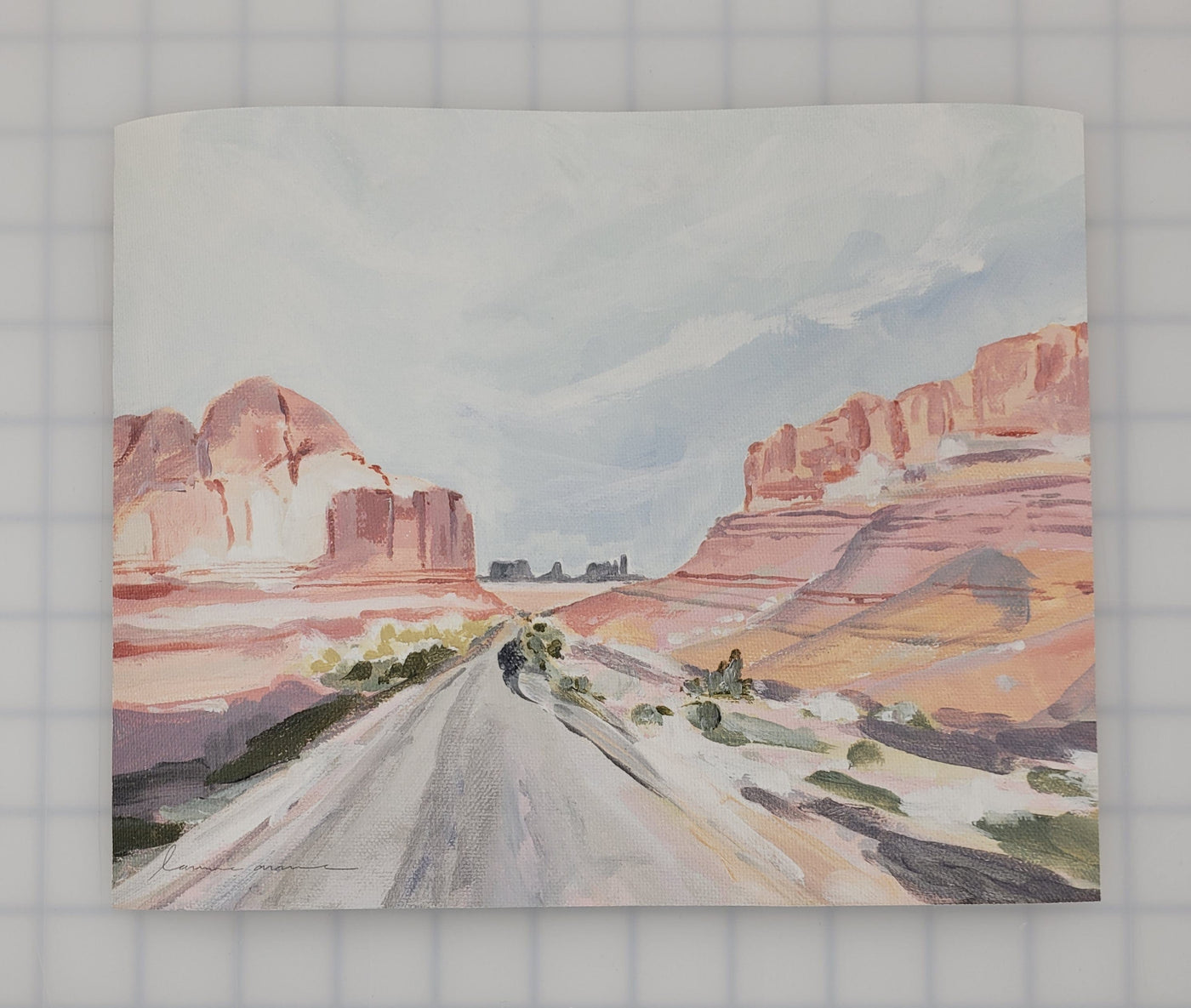Painting of a road through a desert landscape.